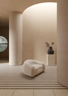 a white chair sitting on top of a tiled floor