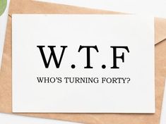 a card with the words w t f who's turning forty? on it