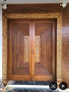 two wooden doors with intricate carvings on the front and side panels, in an ornate style