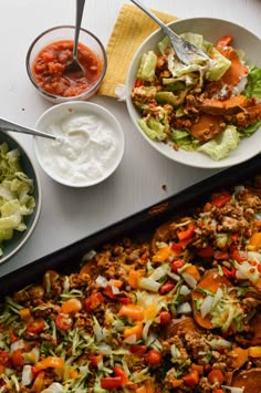 the meal is prepared and ready to be eaten on the table with other dishes around it