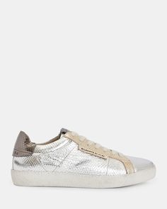 These are our popular Sheer Sneakers, now in cool metallics. Crafted from textured leather with contrasting panels - they're a little bit retro.   If you are between sizes, we recommend sizing up Low top sneakers Vintage-inspired Distressed finish Contrasting ankle panel AllSaints 01-11-94 branding Jeans Trousers Women, Fashion Boards, 3 Shoes, Leather Trainers, Jacket Sale, Jeans For Sale, All Saints