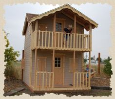 there is a small house with a porch and balcony on the second floor, as well as a deck