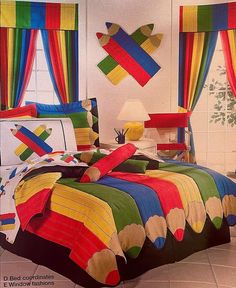 a bed room with a neatly made bed covered in colorful sheets and pillows on top of it