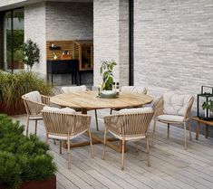 a wooden table sitting on top of a wooden deck