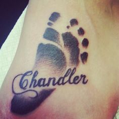 a foot with the word chandler on it and footprints in black ink that reads chandler