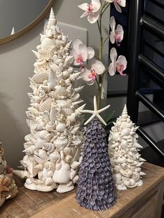 three different types of seashell christmas trees