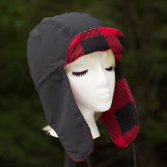 Rain resistant lumberjack ear flaps hat. Size M-L Classic Lumberjack Ear Flaps Hat for fall and winter and outings. Winter's comin' Reach for a rain resistant hat where the chin straps make it secure or hold up the ear flaps until you need them This trapper hat features a black rain-resistant fabric and a buffalo plaid fleece liner and on the brim and neck flap. The style is a 'squared top' favored by trappers, hunters, and maybe Elmer Fudd. The seams have been top stitched for extra durability. Lumberjack Hat, Hat With Ear Flaps, Elmer Fudd, Ear Flap Hats, Black Rain, Trapper Hat, Trapper Hats, Packing Tape, Ear Hats