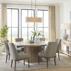 a dining room table with chairs around it