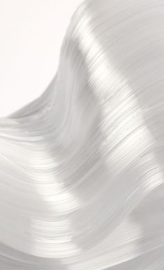 an abstract white background with wavy lines on the bottom and top part of the image