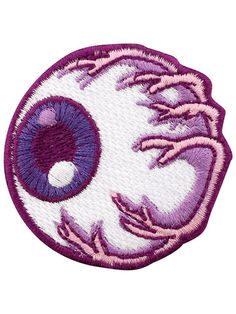 an eyeball embroidered patch on a white background