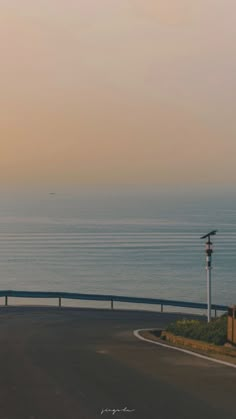 an airplane is flying over the ocean on a clear day