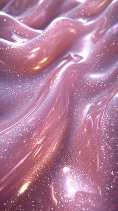 an abstract background with pink and gold colors, like liquid or glitters on the surface