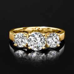 Ross-Simons - 2.00ct t. w. Lab Grown Diamond Three-Stone Ring Round Cut in 14kt Yellow Gold. Size 7. Impeccable sparkle times three! Our exceptional three-stone ring flashes 2.00 ct. t. w. round brilliant-cut lab-grown diamonds in a high-polished 14kt yellow gold setting. Lab-grown diamonds are identical to mined diamonds according to their optical, physical and chemical properties. All Ross-Simons lab-grown diamond jewelry includes an IGI Laboratory-Grown Diamond Report to verify cut, color, cl Gold Three Stone Cluster Ring, Gold Cluster Ring With Three Stones, Classic Gold Three Stone Cluster Ring, Physical And Chemical Properties, Pure Design, Diamond Birthstone, Yellow Gold Setting, Three Stone Rings, 14kt Gold