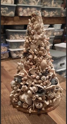 a christmas tree made out of seashells on a table