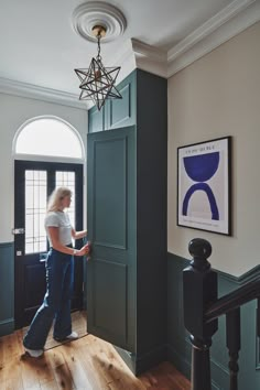 a woman standing in front of a doorway