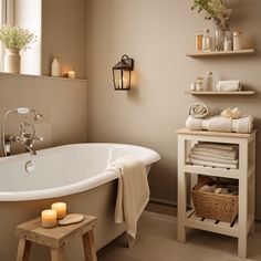 a white bath tub sitting under a window next to a wooden shelf filled with candles