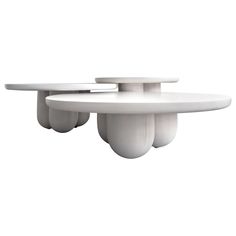 two white tables sitting on top of each other