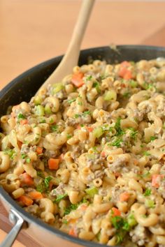 a skillet filled with macaroni and vegetables