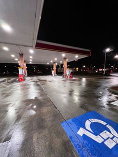 an empty gas station at night with no people