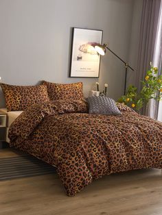 a leopard print comforter set in a bedroom