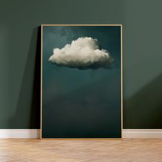 Add a touch of elegance to your home with this captivating art print of a single cloud on a dark teal green background. This minimalist artwork would make a perfect eye-catching addition for anyone looking for a large wall art print for a modern living room or bedroom. 🌳CHOOSE OUR PRINTS 🌳 - Poster printed on 100% cotton canvas - Anti-fade, toxin-free inks - Giclee print with 3x more colours than a standard print - Water-resistant matte finish 🖼️ FRAMING OPTIONS 🖼️ Unframed Prints  - 100% co Moody Sky, Moody Vintage, Teal Wall Art, Wall Art Dark, Dark Blue Walls, Captivating Art, Abstract Art Poster, Cloud Print, Cloud Art