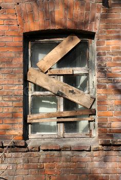 an old window with wooden planks on it