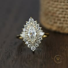 a diamond ring sitting on top of a wooden table