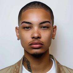 a close up of a person wearing a leather jacket and piercings on his head