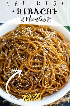 a bowl filled with noodles and sesame seeds