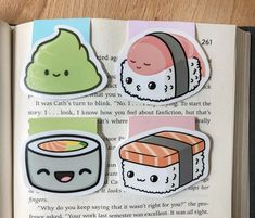 an open book with sushi stickers on it