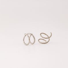 Tiny Double Hoop Earrings, Minimal Spiral Earrings, Tiny Twist Earrings, Double Hoop Earrings, Double Piercing, Diamond Cut Hoop EarringsTwist these little coils in and instantly get the appearance of two lobe piercings.(You only need ONE piercing to make these work-- they give the look of two!)(It can also be worn with two holes in case you have them)All you do is thread one side through your first hoop until the other side sits comfortably on your earlobe giving the illusion of a second hole. Silver Hoop Ear Cuff, Nickel-free Silver Hoop Ear Cuff, Minimalist Spiral Hoop Earrings For Pierced Ears, Minimalist Spiral Hoop Earrings, Silver Spiral Hoop Earrings In Metal, Silver Spiral Wrap Earrings, Pierced, Silver Spiral Hoop Earrings With Ear Wire, Metal Hoop Ear Cuff As Gift, Spiral Earrings With A Modern Twist