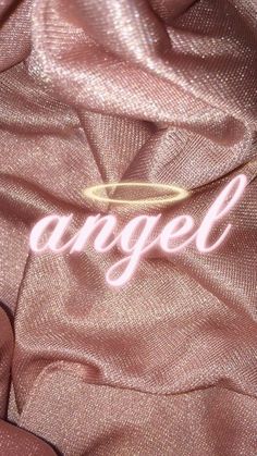 an angell logo is shown on the back of a pink jacket with gold trim