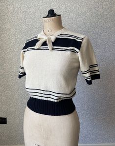 1930s Summer Sweater - adapted from an original 1930s knitting pattern, this 30s summer style has a lovely stripe pattern with a neat little collar fastening in a bow. It's machine knitted in a wool/cotton blend, a beautiful organic yarn 70% merino wool/30% cotton, and is sewn together by hand, with some crochet trim around the neck opening. Black & cream  Size - best fits up to 35" bust Measurements laid flat: Bust 17" Length 18.5" Inside sleeve 5" (Shown on mannequin with 35" bust/25" waist) P Knitting Collar Pattern, 1930s Outfits For Women, 1930s Winter Fashion, 1930s Sweater, 30s Clothes, 50s Sweater, 1930s Clothing, 1930s Outfits, Sweater Inspiration