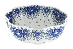 two blue and white flowered bowls on a white background with one bowl in the middle