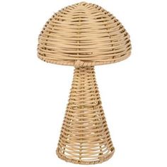 a wicker table lamp on a white background