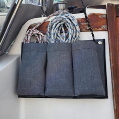 the inside of a boat with ropes and cords in its pocket on the front of it