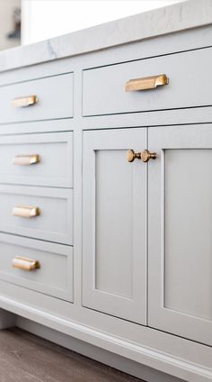 the instagram page on instagram com shows an image of a white dresser with gold handles