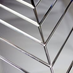 a close up view of a metal structure with many lines on the bottom and sides