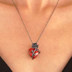 Feel the allure of our Gothic Rose Heart Necklace! This exquisite piece features a mesmerizing red crystal rose, symbolizing passion and love. The delicate metal rose entwined around the heart adds a touch of preciousness to this beautiful necklace. Truly a must-have for anyone who appreciates beauty and romance. 🌹❤️ Description: Origin: CNMaterial: Metal/Alloy ZirconMetals Type: Zinc AlloyShape\Pattern: Heart Rose Red Necklace, Collar Rosa, Red Heart Necklace, Grunge Jewelry, Gothic Rose, Y2k Jewelry, Womens Chokers, Red Love, Human Heart