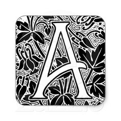 the letter a is surrounded by black and white doodled flowers on a square coaster