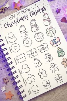 a spiral notebook with christmas stickers on it and stars around the pages that says how to draw christmas embellishments