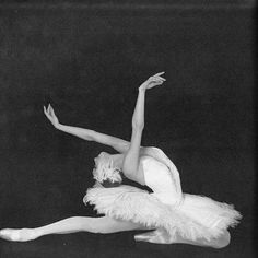 a black and white photo of a ballerina