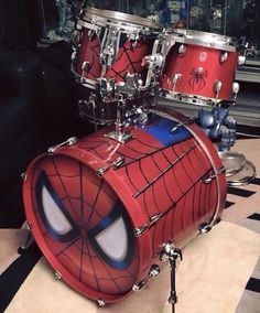 a spiderman drum kit is sitting on a table