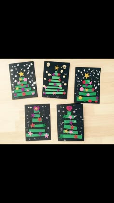 four pieces of paper with christmas trees on them