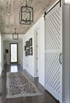 an image of a hallway with white doors and wood ceilinging on the side walk