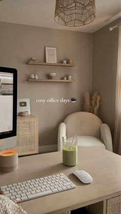 a computer monitor sitting on top of a desk next to a keyboard and mouse in front of a window