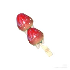 two red candy lollipops sitting on top of each other