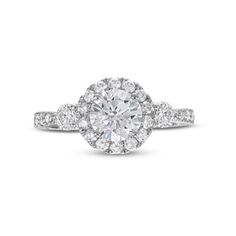 an oval cut diamond ring with pave set shoulders