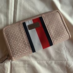 Blush Pink Zip Tommy Hilfiger Wallet With Tommy Monogram And Stripe New Without Tags Width 8” Height 4.5” Open To Offers! Tommy Hilfiger Bag With Removable Pouch, Tommy Hilfiger Travel Bags With Zipper Closure, Tommy Hilfiger Tan Tote Bag, Tommy Hilfiger Wallet, Tommy Hilfiger V-neck Tops, Denim Wallet, Tommy Hilfiger Bags, Tommy Hilfiger Sweatshirt, Leather Crop Top