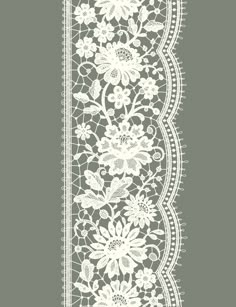 a white lace border with flowers on it